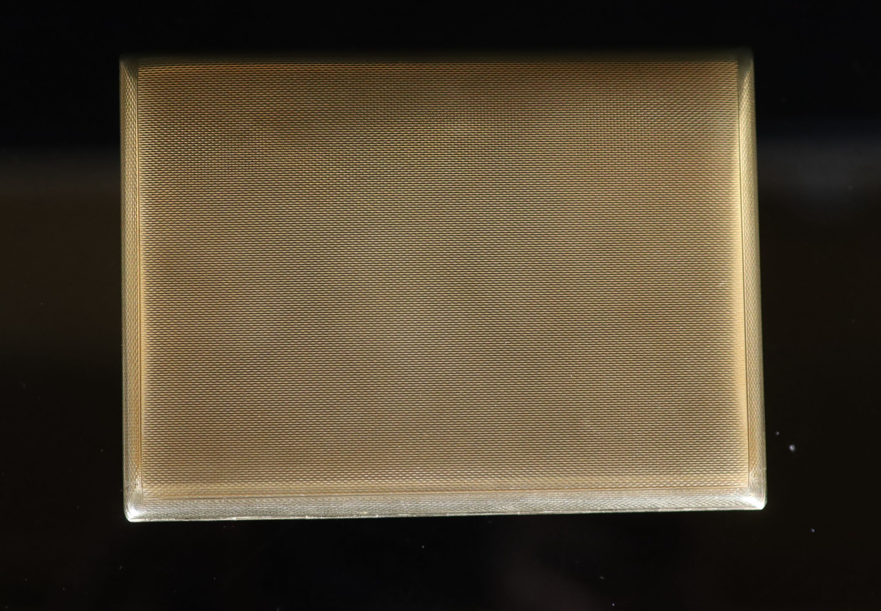 A 1950's Garrard & Co engine turned 9ct gold cigarette case